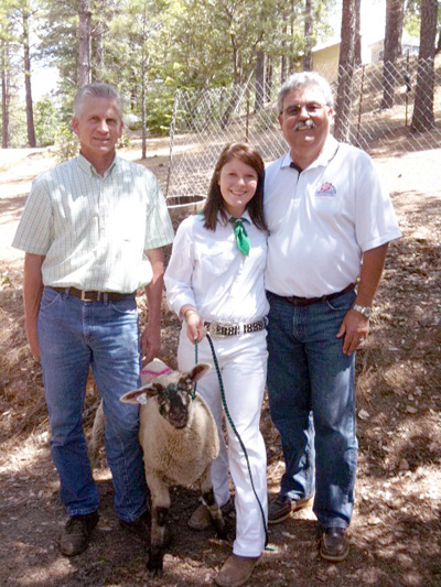 Bear River Ag teacher, Steve Paasch; Paige Lampert, who is raising the Heritage Lamb for the Nevada County Fairgrounds Foundation; and Ed Mertens, Nevada County Fairgrounds Foundation Board Member.